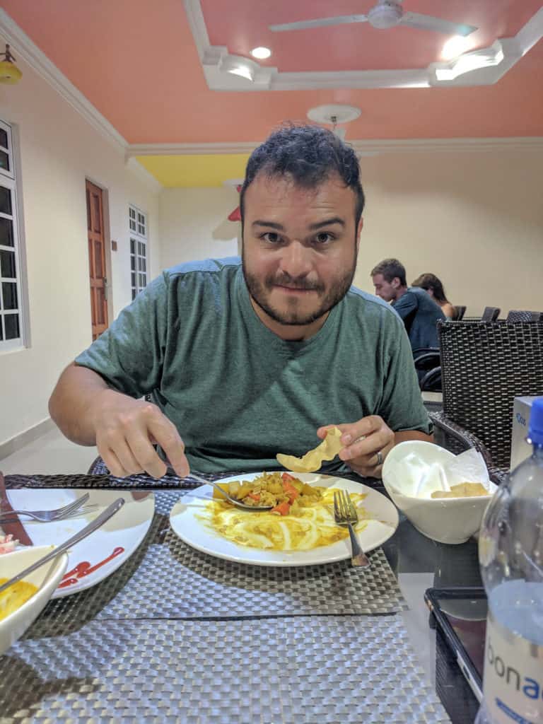 Mike eating curry on Maafushi Island