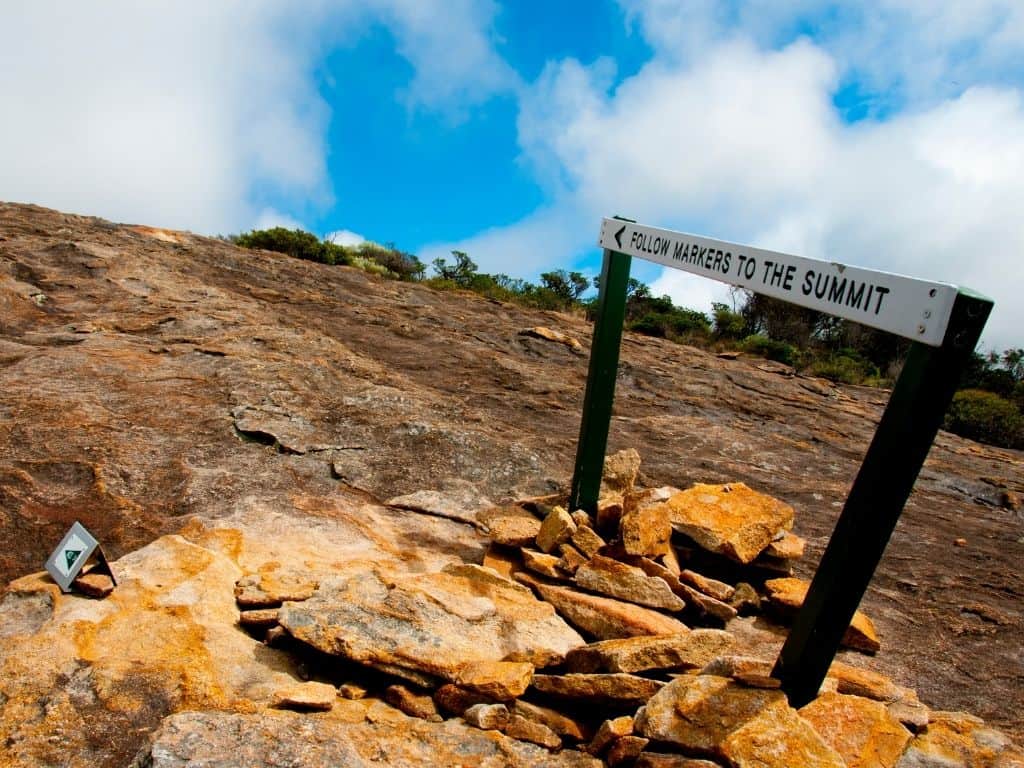 A sign directing hikers to the summit of Frenchman Peak near Lucky Bay, Australia